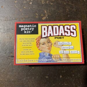 Magnetic poetry kit on wooden table