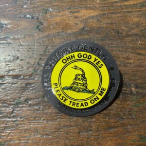 Yellow patch with snake on wooden surface