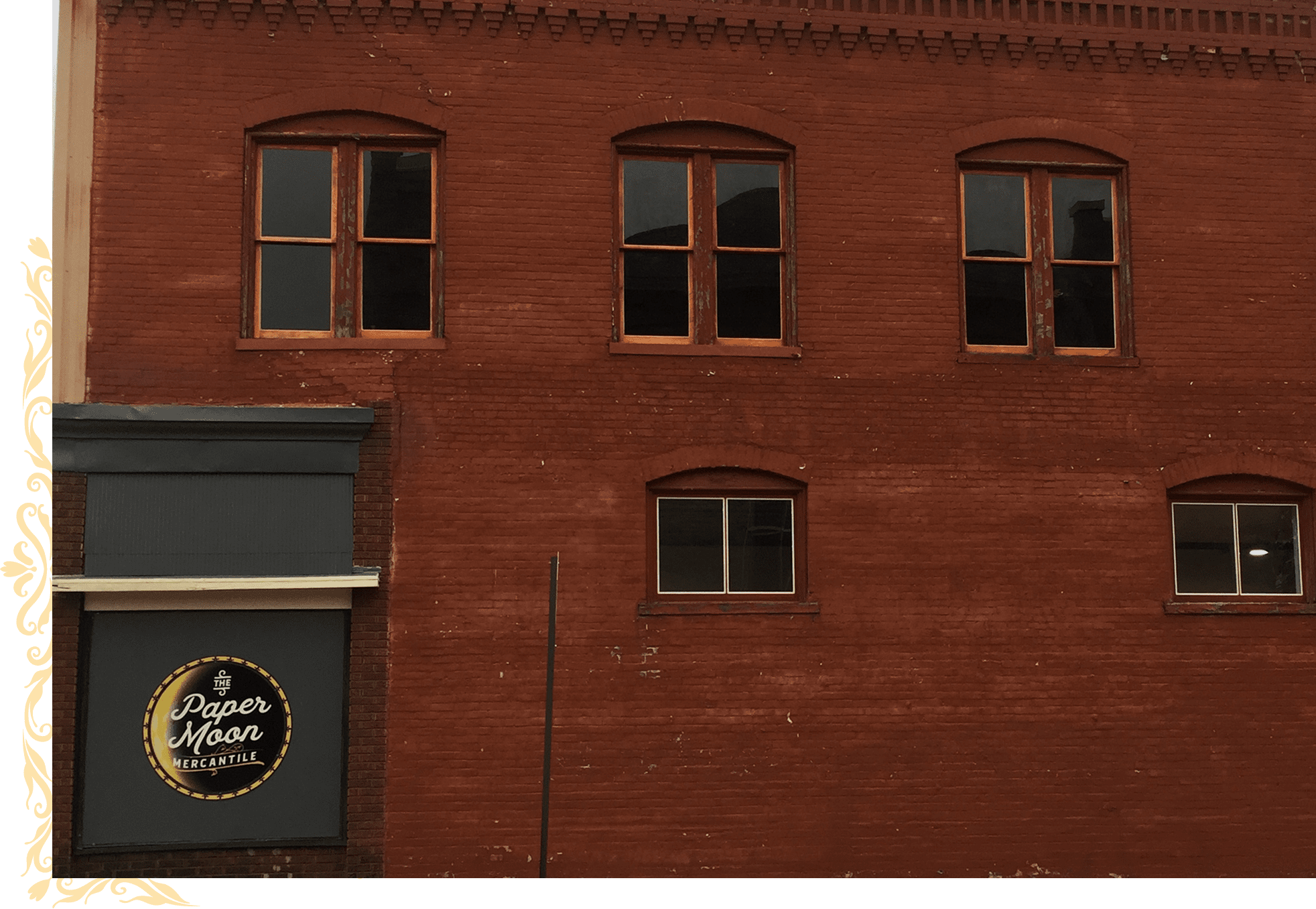 Brick building with Paper Moon sign