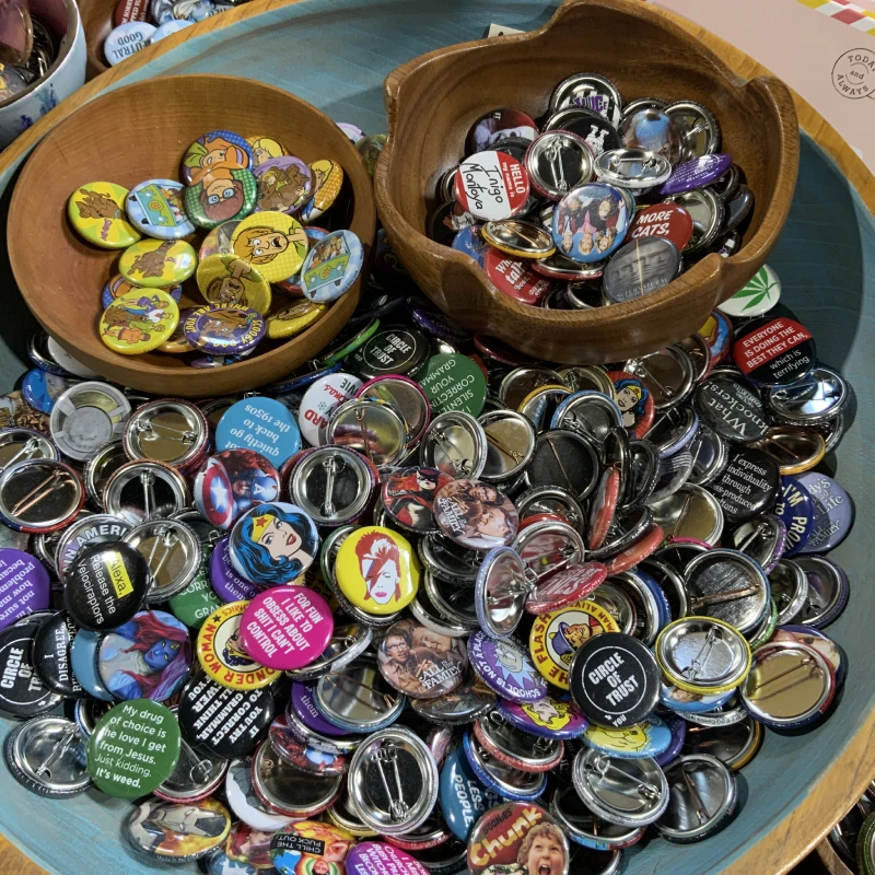 Collection of colorful pins in bowls
