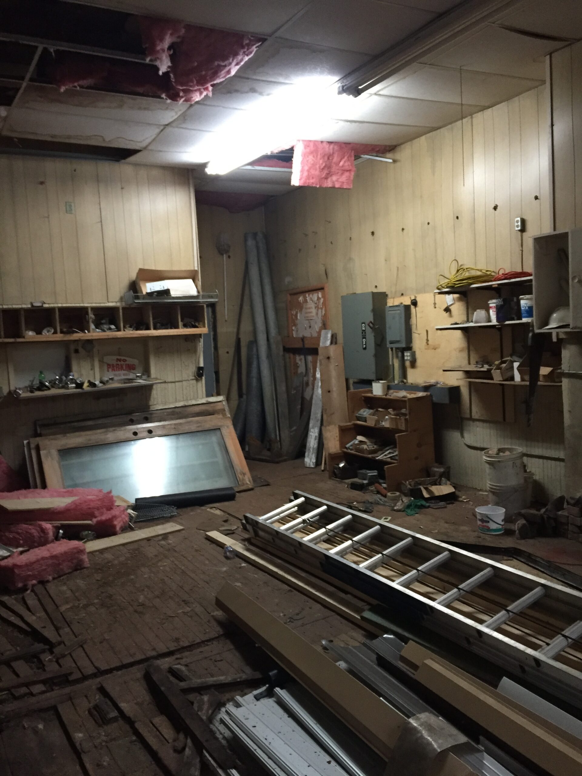 Dimly lit storage room with shelves