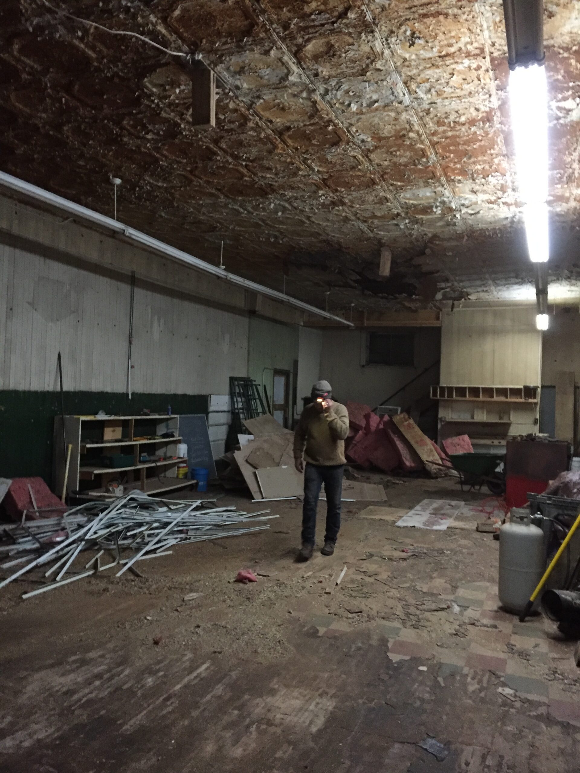 Dimly lit, cluttered workshop interior