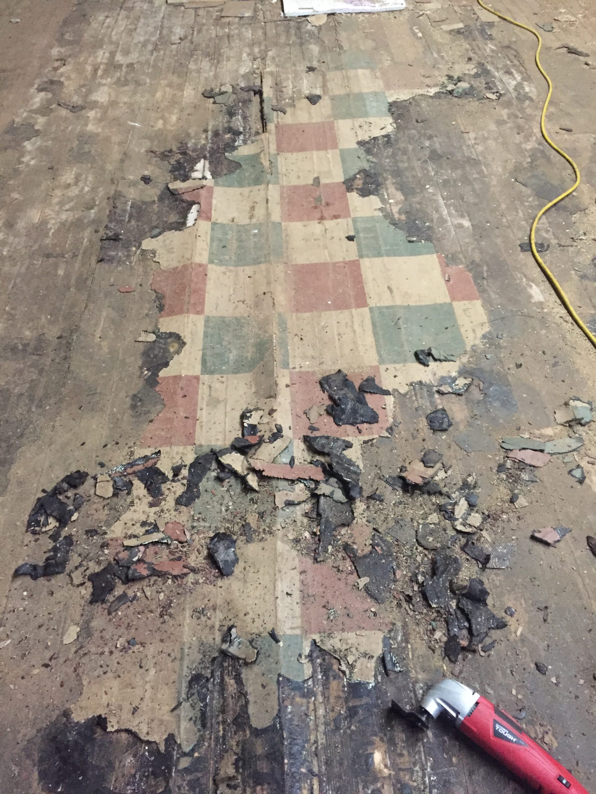 Damaged linoleum with visible tools