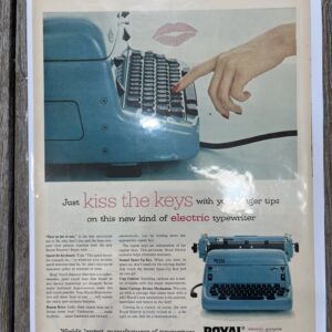 Vintage typewriter advertisement with hand