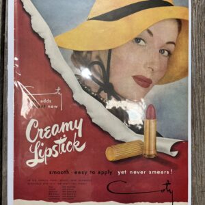 Vintage lipstick advertisement with woman in hat.
